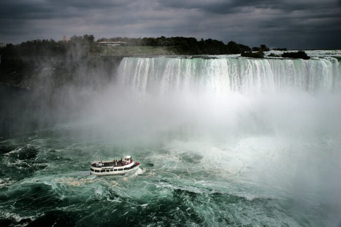 aerial photography of white and brown ship on Niagara, Canada falls during daytime