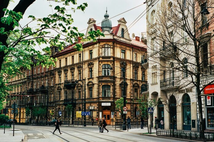 people walking near beige building